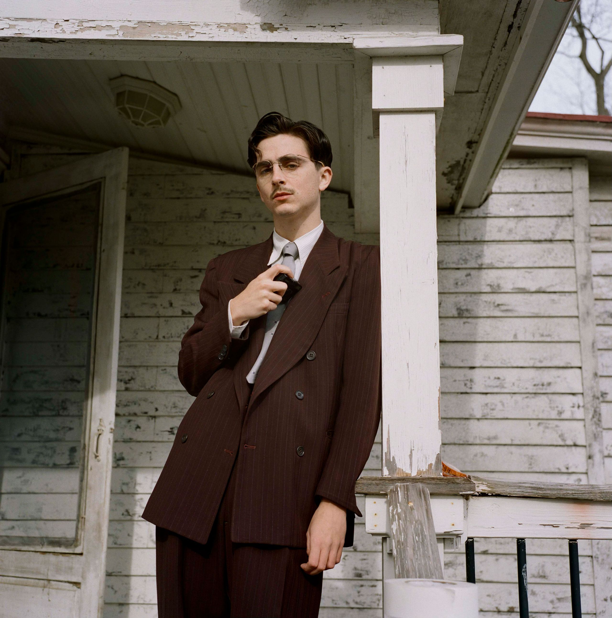 Image may contain Timothe Chalamet Clothing Formal Wear Suit Blazer Coat Jacket Adult Person Accessories and Tie